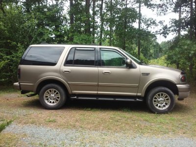 my 2002 ford expedition passenger's side with the running boards painted black.jpg