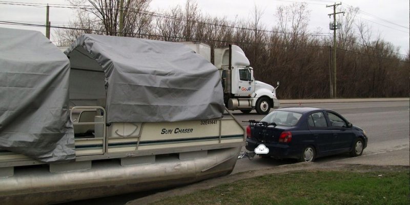 A-tiny-Toyota-Echo-pulls-a-massive-pontoon-boat..jpg